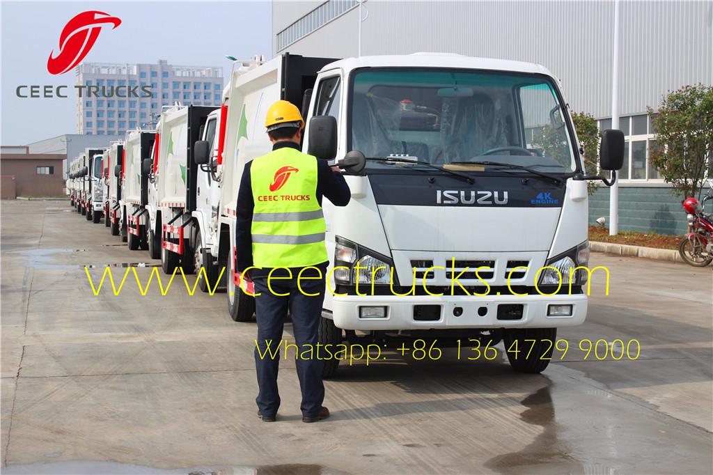 ceec engineer testing isuzu 5cbm garbage compactor truck ceec engineer testing isuzu 5cbm garbage compactor truck